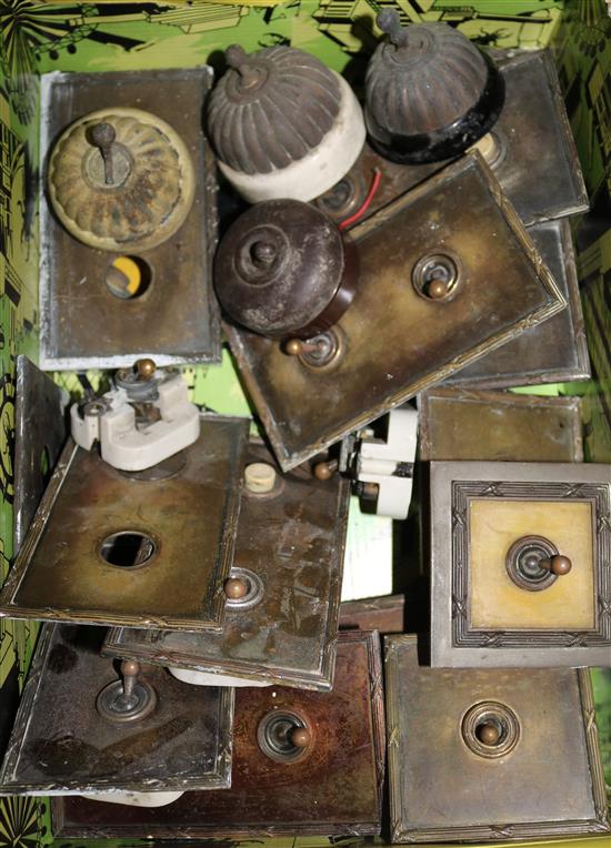 A collection of 1920s-30s light switches